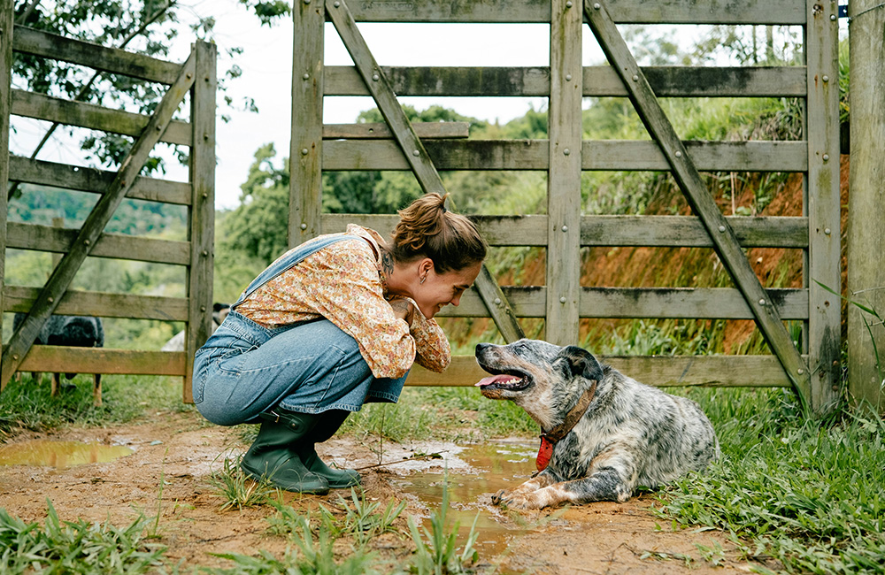 country-dog-woman A woman and her dog enjoying their countryside yard
